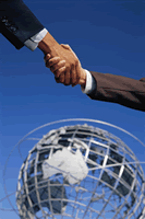 image of a handshake against a blue sky
